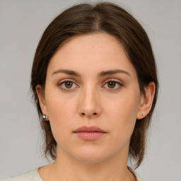 Neutral white young-adult female with medium  brown hair and brown eyes