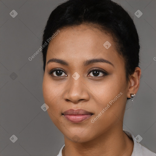 Joyful latino young-adult female with short  black hair and brown eyes