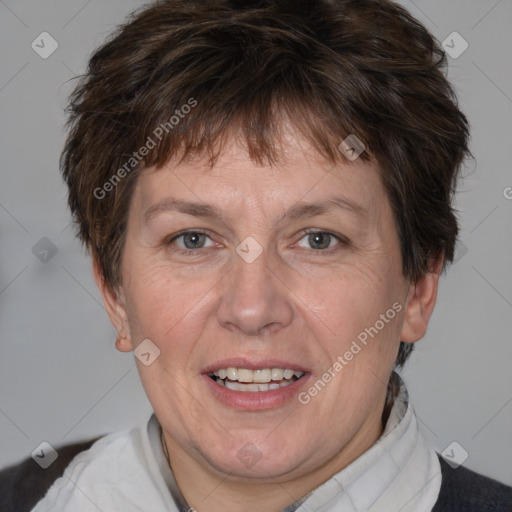 Joyful white adult female with short  brown hair and brown eyes