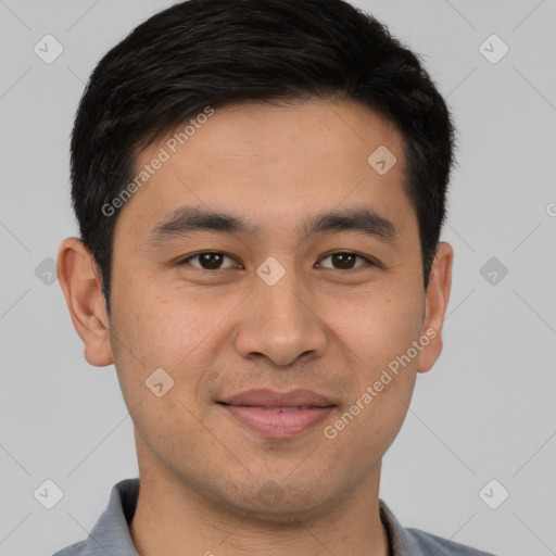 Joyful white young-adult male with short  black hair and brown eyes