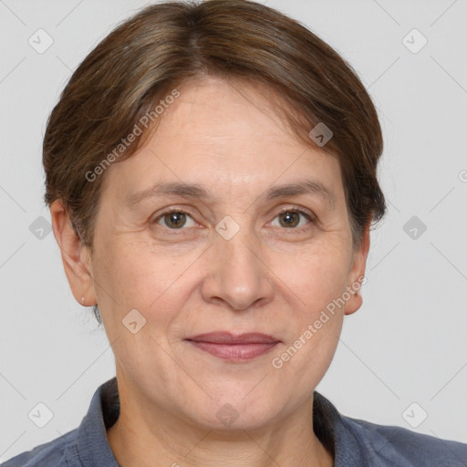 Joyful white adult female with short  brown hair and grey eyes