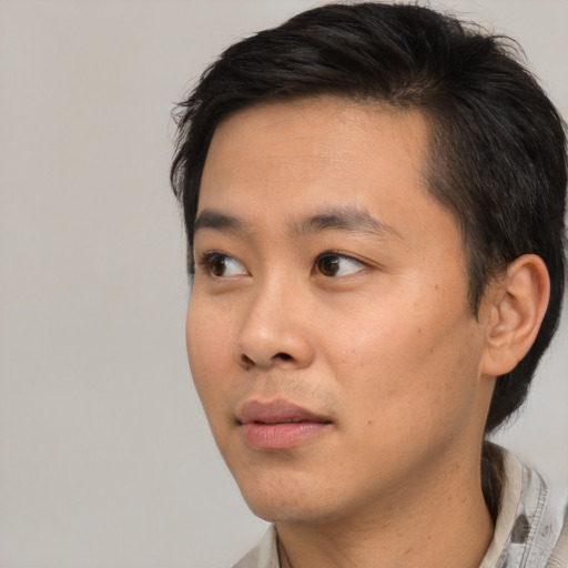 Neutral asian young-adult male with short  black hair and brown eyes