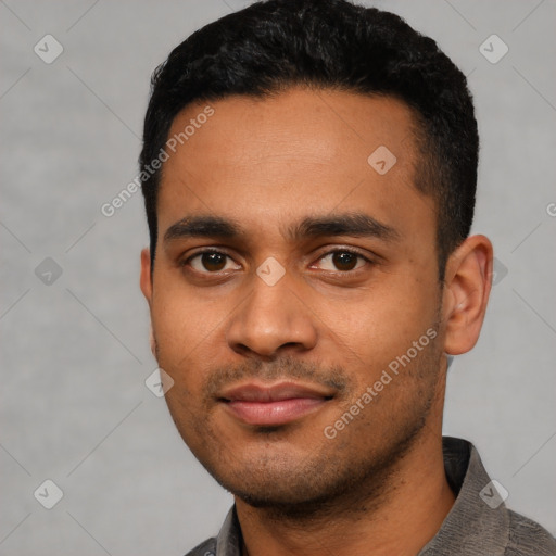 Joyful latino young-adult male with short  black hair and brown eyes