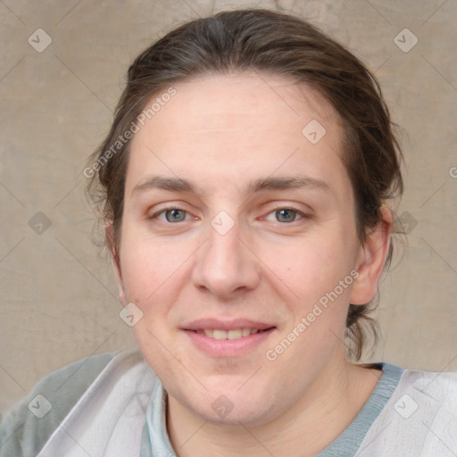 Joyful white adult female with medium  brown hair and grey eyes