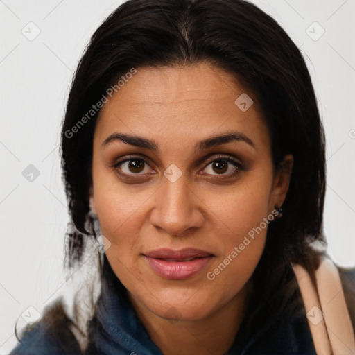 Joyful latino young-adult female with long  brown hair and brown eyes