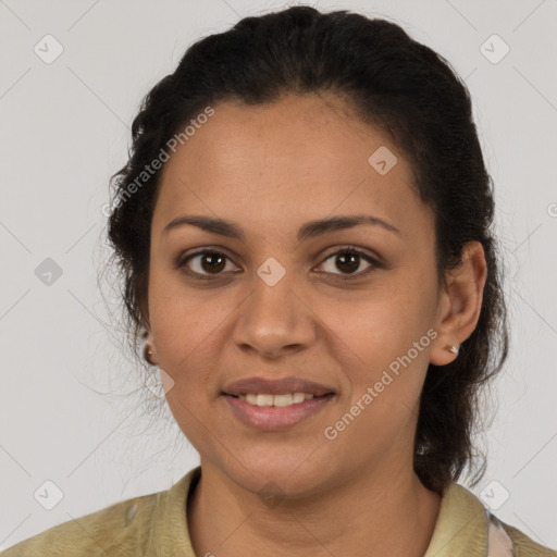 Joyful latino young-adult female with medium  brown hair and brown eyes