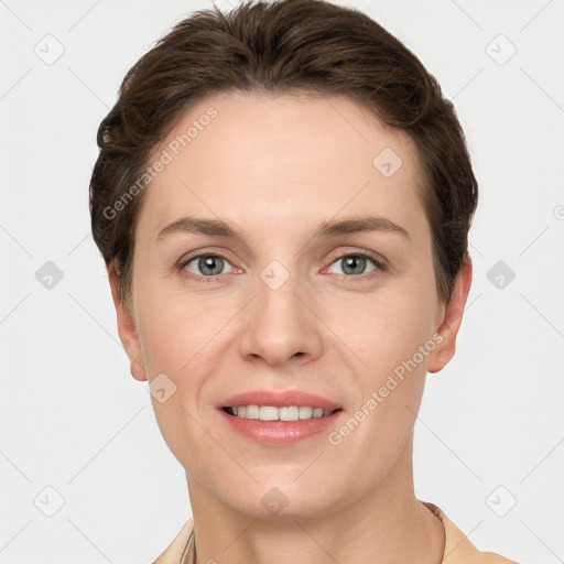 Joyful white young-adult female with short  brown hair and grey eyes