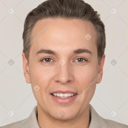 Joyful white adult male with short  brown hair and brown eyes