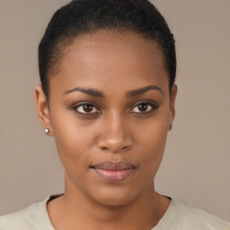 Joyful black young-adult female with short  brown hair and brown eyes