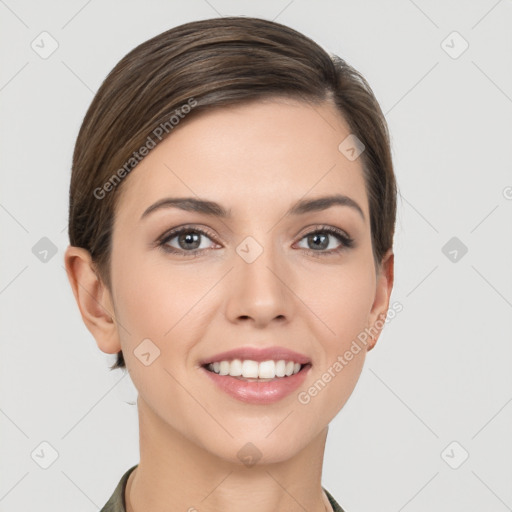 Joyful white young-adult female with short  brown hair and brown eyes