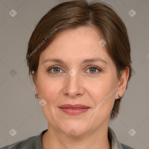 Joyful white adult female with medium  brown hair and grey eyes