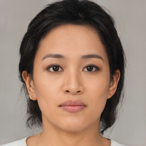 Neutral asian young-adult female with medium  black hair and brown eyes