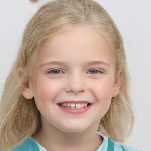 Joyful white child female with medium  blond hair and blue eyes