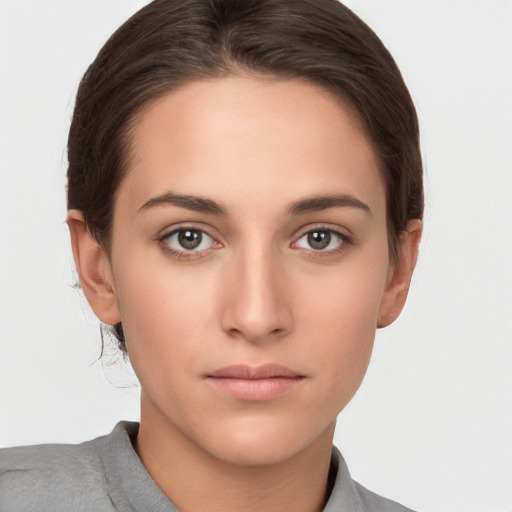 Neutral white young-adult female with short  brown hair and brown eyes