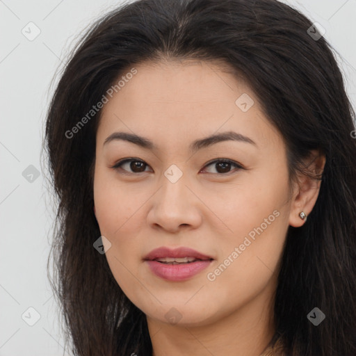 Joyful asian young-adult female with long  brown hair and brown eyes