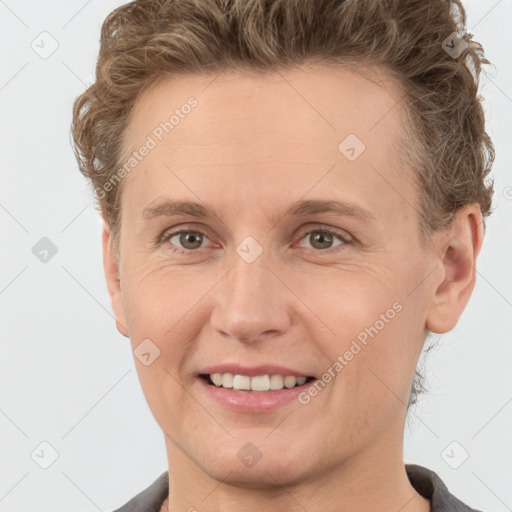 Joyful white adult female with short  brown hair and grey eyes