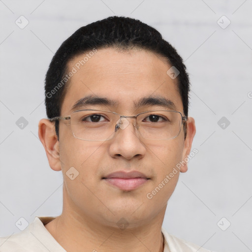 Joyful asian young-adult male with short  brown hair and brown eyes
