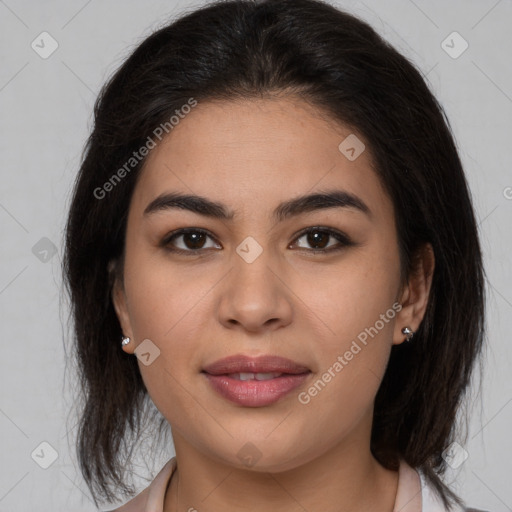 Joyful latino young-adult female with medium  brown hair and brown eyes