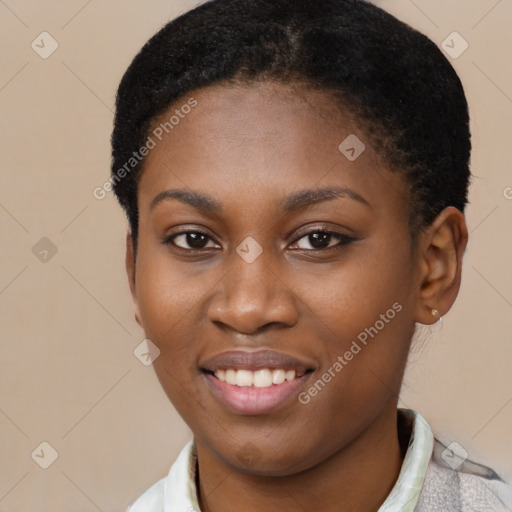 Joyful black young-adult female with short  brown hair and brown eyes