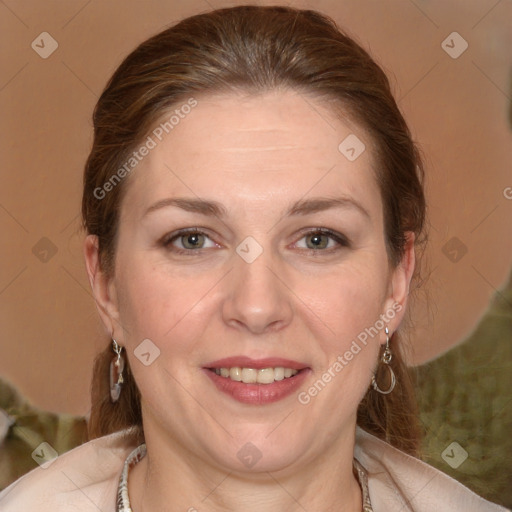 Joyful white adult female with medium  brown hair and grey eyes