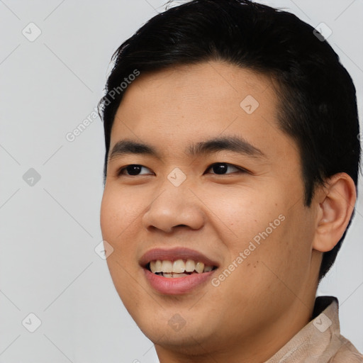 Joyful asian young-adult male with short  black hair and brown eyes