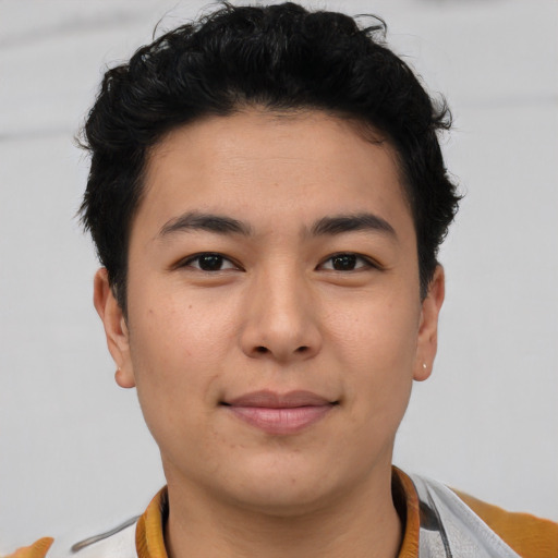 Joyful asian young-adult male with short  brown hair and brown eyes