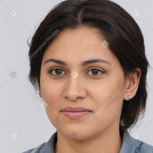 Joyful latino young-adult female with medium  brown hair and brown eyes