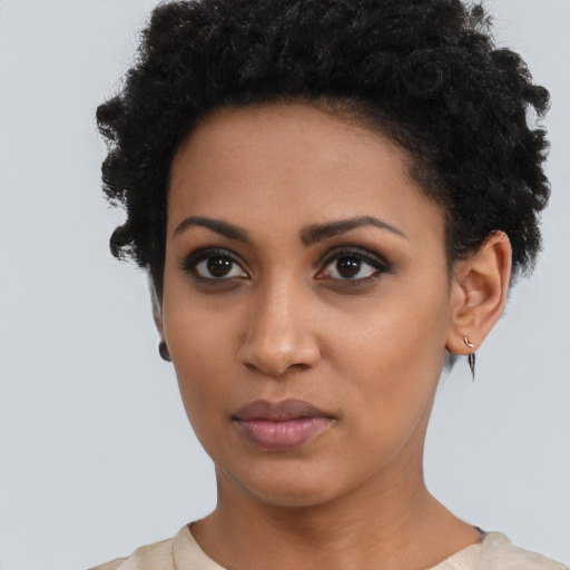 Neutral latino young-adult female with short  black hair and brown eyes