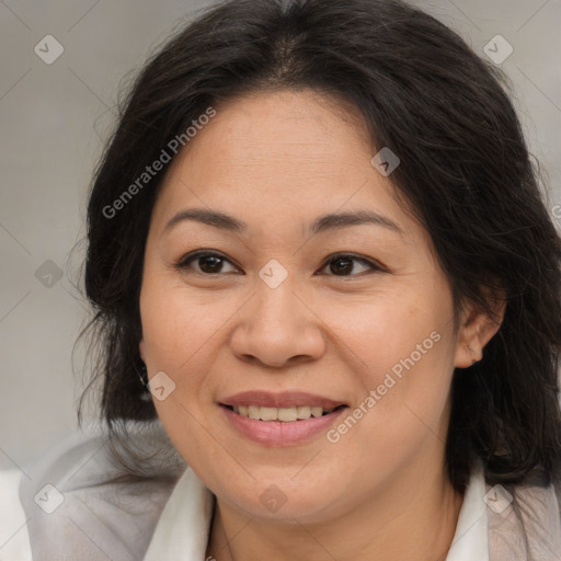 Joyful white adult female with medium  brown hair and brown eyes