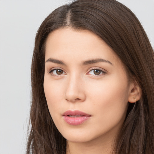 Neutral white young-adult female with long  brown hair and brown eyes