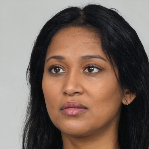 Neutral black young-adult female with long  black hair and brown eyes