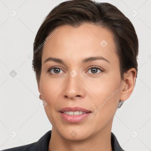 Joyful white young-adult female with short  brown hair and brown eyes