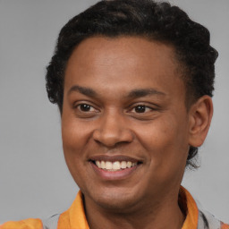 Joyful latino young-adult male with short  brown hair and brown eyes