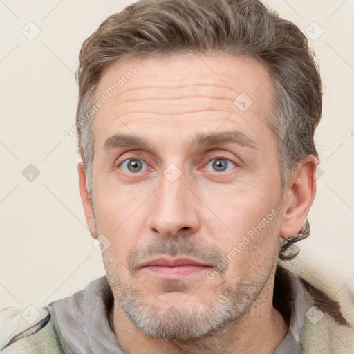 Neutral white adult male with short  brown hair and grey eyes