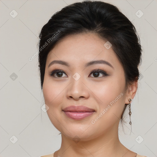 Joyful asian young-adult female with long  brown hair and brown eyes