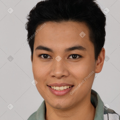 Joyful latino young-adult male with short  black hair and brown eyes