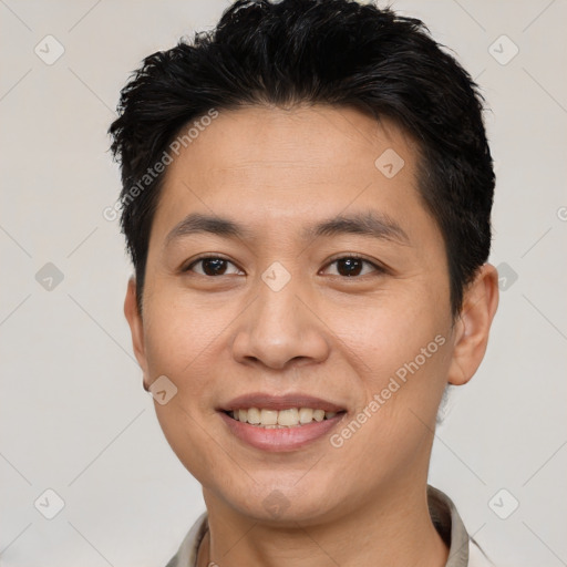 Joyful white young-adult male with short  brown hair and brown eyes