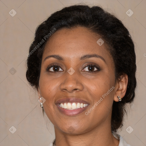 Joyful black young-adult female with medium  brown hair and brown eyes