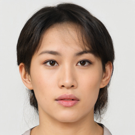 Neutral asian young-adult female with medium  brown hair and brown eyes