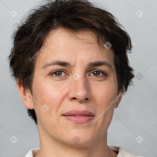 Joyful white adult female with short  brown hair and brown eyes