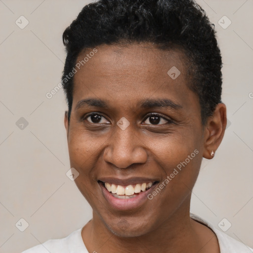 Joyful black young-adult male with short  black hair and brown eyes