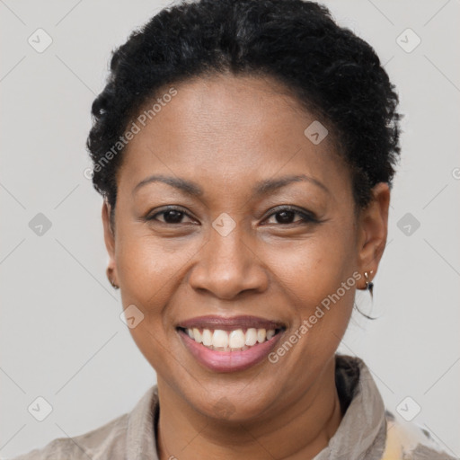 Joyful black adult female with short  brown hair and brown eyes