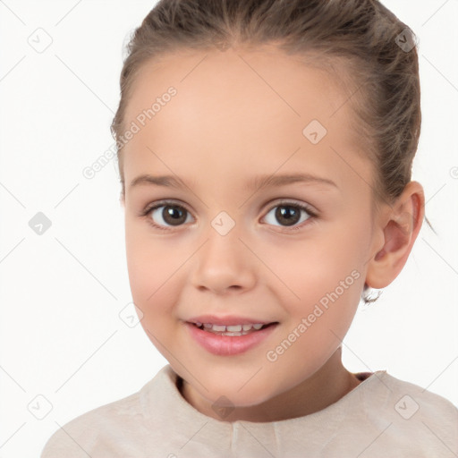 Joyful white child female with short  brown hair and brown eyes