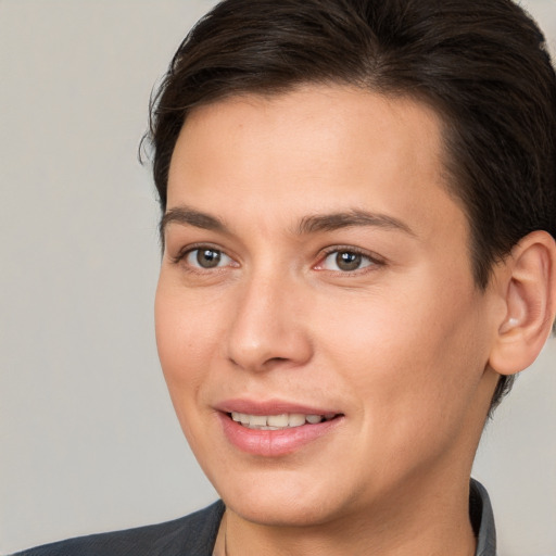 Joyful white young-adult female with short  brown hair and brown eyes