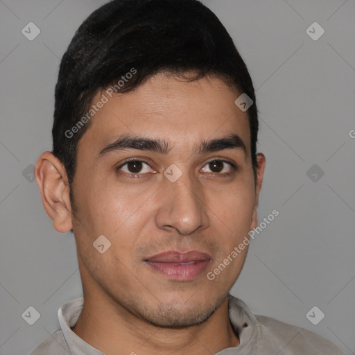 Joyful latino young-adult male with short  brown hair and brown eyes