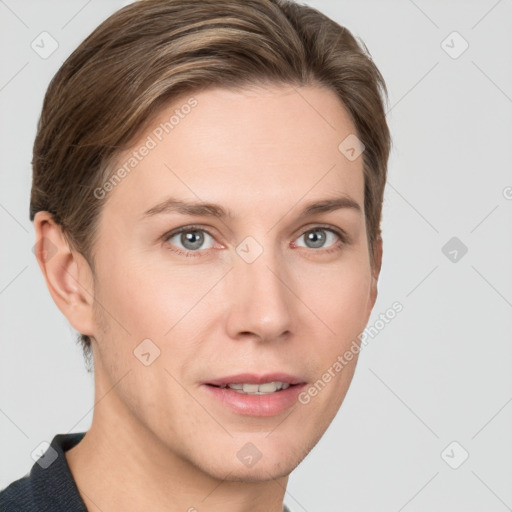 Joyful white young-adult female with short  brown hair and grey eyes