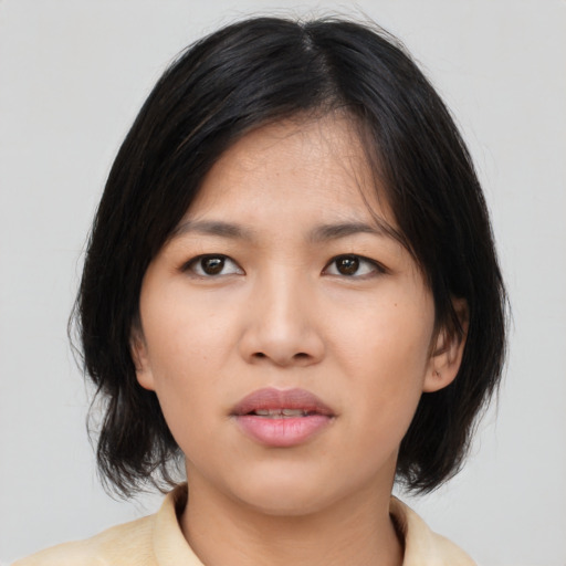 Neutral asian young-adult female with medium  black hair and brown eyes