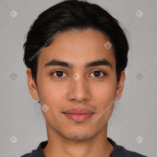 Joyful latino young-adult male with short  black hair and brown eyes