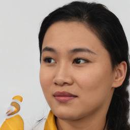 Joyful asian young-adult female with short  brown hair and brown eyes
