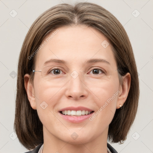 Joyful white adult female with medium  brown hair and grey eyes